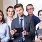 successful-business-team-looking-camera_1262-2017